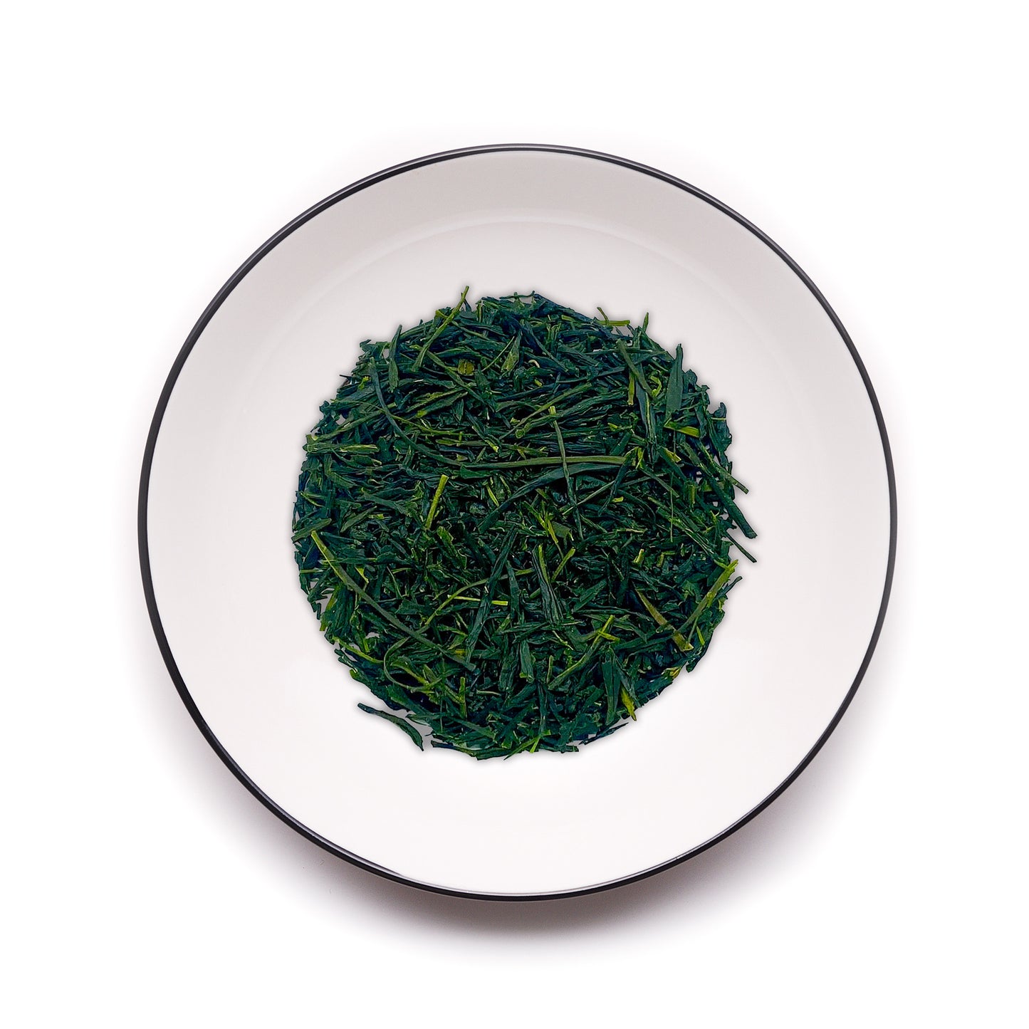 Premium Uji Sencha tea leaves from MAISON TOMOKI on a white plate with a black rim, showcasing vibrant green color, fresh grassy aroma, and refined Japanese tea craftsmanship.